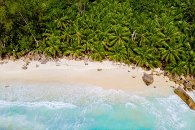 Drone view from above at a tropical beach in the Seychelles Mahe Island