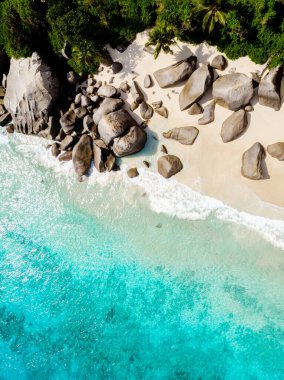 Drone view from above at a tropical beach in the Seychelles Mahe Island