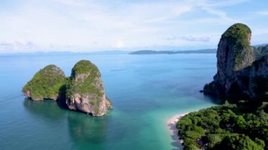 Aerial drone view of the limestone cliffs and tropical beach of Railay Beach Krabi Thailand. 