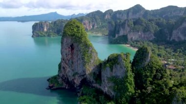 Aerial drone view of the limestone cliffs and tropical beach of Railay Beach Krabi Thailand. 