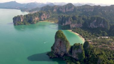 Aerial drone view of the limestone cliffs and tropical beach of Railay Beach Krabi Thailand. 