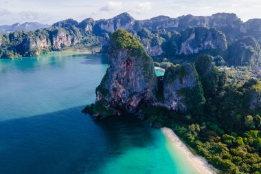 Railay Beach Krabi Thailand, the tropical beach of Railay Krabi, drone view from above, Panoramic view of idyllic Railay Beach in Thailand with a traditional long boat.