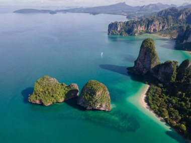 Railay Beach Krabi Thailand, the tropical beach of Railay Krabi, drone view from above, Panoramic view of idyllic Railay Beach in Thailand with a traditional long boat.
