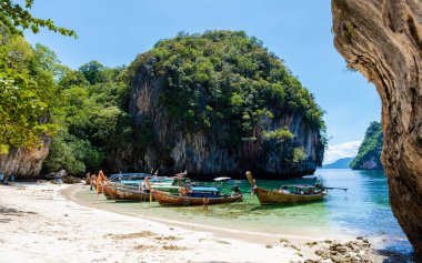 Koh Loa Lading Krabi Thailand July 2022 part of the Koh Hong Islands in Thailand. beautiful beach with limestone cliffs and longtail boats with tourist on a sunny day