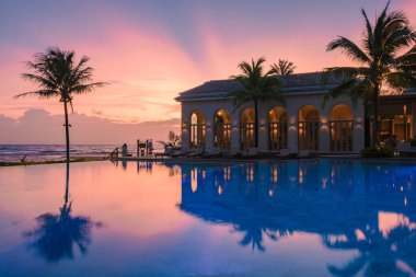 sunset at a swimming pool during a vacation on a tropical island sunset on a tropical beach