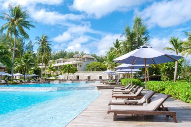 Khao Lak Thailand June 2022, Devasom a luxury hotel at the beach of Khao Lak in Arabic style, a modern hotel, with a beautiful swimming pool with bed chairs and sun loungers in Thailand