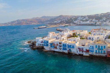Drone view of Mykonos Greek village in Greece, colorful streets of Mikonos village.
