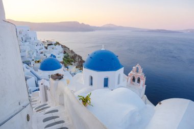 sunrise by the ocean of Oia Santorini Greece, a traditional Greek village in Santorini. 