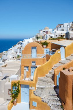 White churches and blue domes by the ocean of Oia Santorini Greece, a traditional Greek village in Santorini in the evening light