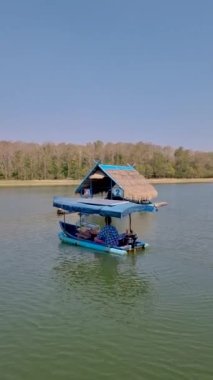 Huai Krathing lake in North Eastern Thailand Isaan region Loei February 2023 is famous for its floating bamboo rafts where you can have lunch or dinner in the middle of the lake. 