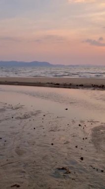 sunset on the beach of Pattaya Thailand in the evening with palm trees