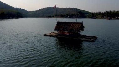 Huai Krathing lake in North Eastern Thailand Isaan region is famous for its floating bamboo rafts where you can have lunch or dinner in the middle of the lake. 