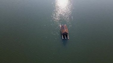 Huai Krathing lake in North Eastern Thailand Isaan region famous for its floating bamboo rafts where you can have lunch or dinner in the middle of the lake. 
