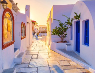 sunrise by the ocean of Oia Santorini Greece, a traditional Greek village in Santorini.
