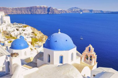 Oia Santorini Greece on a sunny day during summer with whitewashed homes and churches, Greek Island Aegean Cyclades