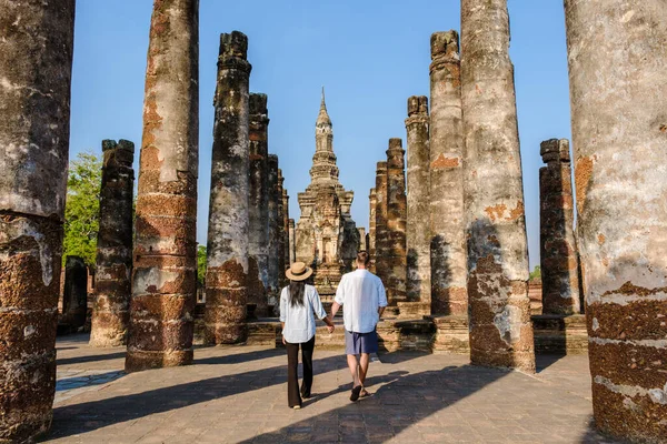 Tourists visiting Wat Mahathat, Sukhothai old city, Thailand. Ancient city and culture of south Asia Thailand, Sukothai historical park