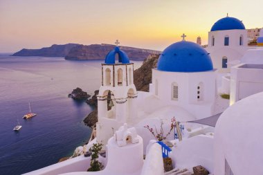 sunrise by the ocean of Oia Santorini Greece, a traditional Greek village in Santorini.