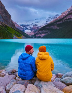 Lake Louise Canadian Rockies Banff national park, of iconic Lake Louise in Banff National Park in the Rocky Mountains of Alberta Canada. Romantic lovely couple men and women by the lake