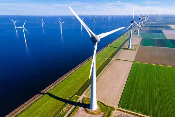 Windmill park in the ocean aerial view with wind turbine Flevoland Netherlands Ijsselmeer. Green Energy production in the Netherlands