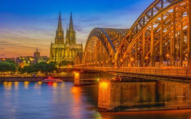 Cologne Koln Germany during sunset, Cologne bridge with the cathedral. beautiful sunset at the Rhine river