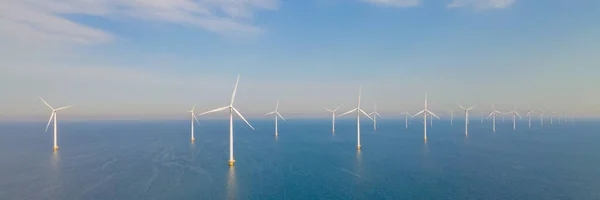 Panoramic view of wind turbines in the ocean