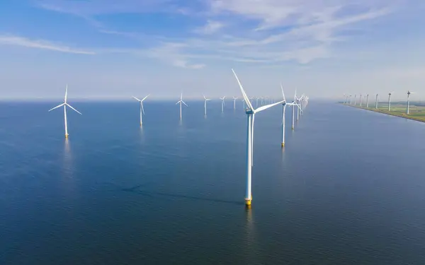 Panoramic view of wind turbines in the ocean