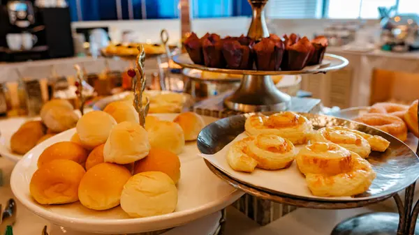 breakfast buffet in a luxury hotel in Thailand, sweets and bread at a plate