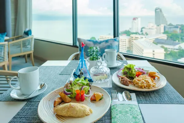 breakfast in a luxury hotel in Thailand, breakfast table with omelet and scrambled eggs