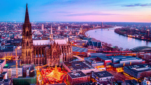 Cologne Germany Christmas market, aerial drone view over Cologne Rhine River Germany Europe during winter at sunset
