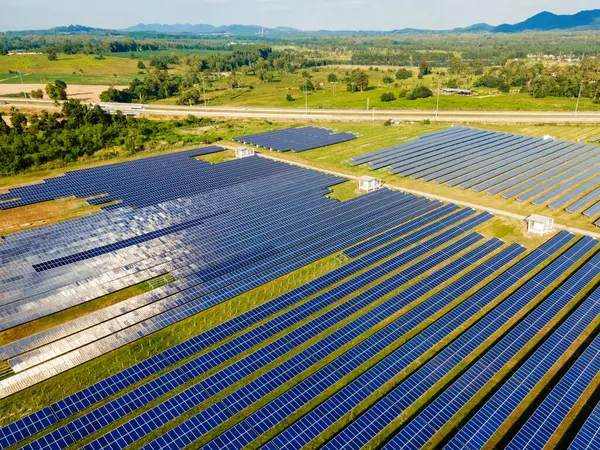 Sun power solar panel field in Thailand in the evening light, drone point of view at a sun energy field in Thailand