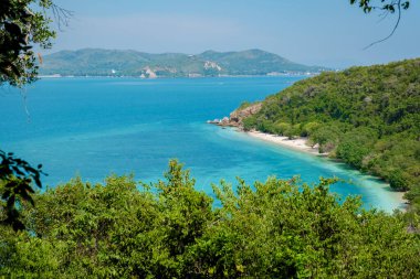 Viewpoint over Ko Kham Island Sattahip Chonburi Samaesan Thailand a tropical island with turqouse colored ocen, you can reach the viewpoint after a short hike in the jungle forest clipart