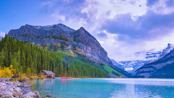 Lake Louise Canadian Rockies Banff National Park, Beautiful autumn views of iconic Lake Louise in Banff National Park in the Rocky Mountains of Alberta Canada at sunset.