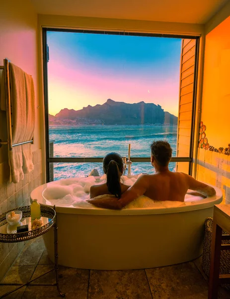 Diverse Couple Men Women Bathtub Looking Out Ocean Cape Town — Stock Photo, Image