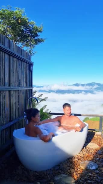 Man Woman Enjoying Leisurely Bath Bathtub Outdoors Surrounded Beautiful Landscape — Stock Video