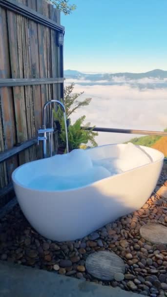Bathtub Filled Water Placed Outdoors Wooden Fence Backdrop Lush Grass — Stock Video