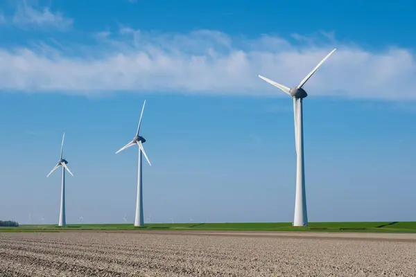 Majestic Row Towering Wind Turbines Spin Gracefully Vast Field Netherlands — Stock Photo, Image