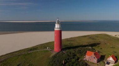 Günbatımında Teksaslı deniz feneri Yazın Hollanda Hollanda Adası Tekeli.