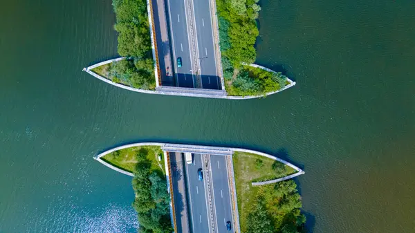 stock image An aerial view of the Veluwemeer Aqueduct in the Netherlands, showcasing the unique design of the bridge that seamlessly blends with the surrounding landscape.