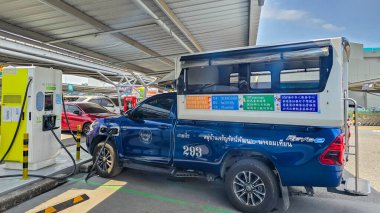 Pattaya Thailand 17 November 2024, A vibrant charging station located in Pattaya facilitates eco-friendly travel. Electric Songthaew vehicles line up, showcasing technology in harmony with nature clipart