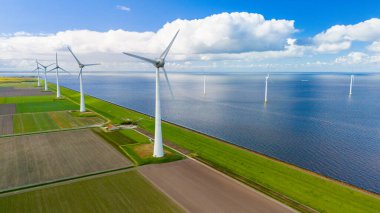 A mesmerizing aerial view of a wind farm near the ocean, where rows of elegant windmill turbines catch the breeze, harnessing clean energy in the Netherlands, Energy transition in Europe clipart