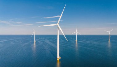 Tall wind turbines stand majestically above calm waters, converting wind into sustainable energy amidst the serene Dutch landscape. offshore windmill farm in ocean, green energy transition, clipart