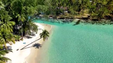 Stunning aerial view of Koh Kood, Thailand showcasing pristine turquoise waters and lush palm-fringed beaches. Ideal for relaxation and enjoying natures beauty in a tropical paradise.