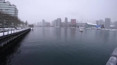 Winter 4K timelapse of waters near Vancouver downtown and boats moving