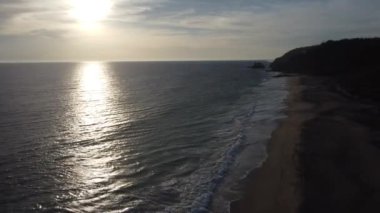 Ocean Waves. Beautiful golden hour footage of waves crashing against the shore.