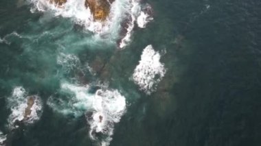 Aerial footage of crystal clear waters and golden sand