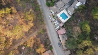 Fly over the village in Mexico on a sunny winter day