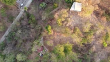 Aerial view of forest in Mexico and small houses