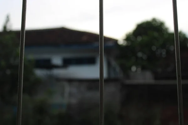 stock image photo of iron bars looking out view