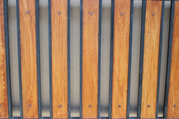 Photo Symmetrical Brown Black Iron Picket Fence — Stock Photo, Image