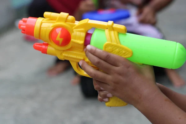 photo of toy gun being carried